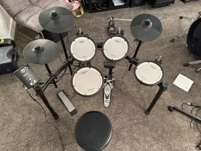 Great condition all triggers work. Comes with Tama Iron Cobra Pedal and a drum throne. Pickup in Par...