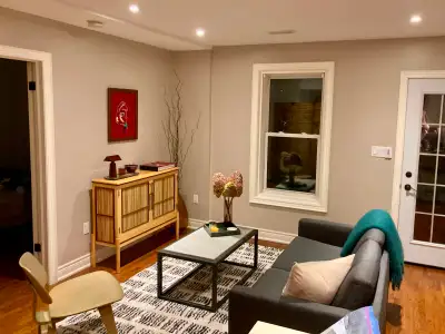 Walk out lower level apartment in a modern space, with a large bright sunroom. Includes a private, d...