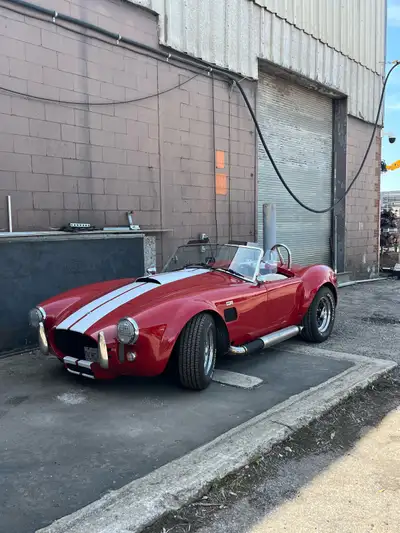 1965 ac cobra, fuel injected 302,brand new 5 speed transmission, plenty of fun,they will always hear...
