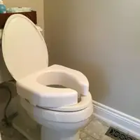 Raised toilet seat by Ableware