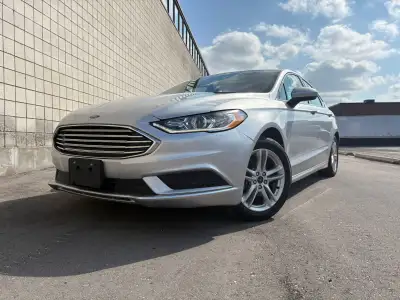 Selling a well-maintained and safety certified 2018 Ford Fusion SE in silver with 80,000 km. This ve...