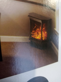 BRAND NEW ELECTRIC FIREPLACE/HEATER
