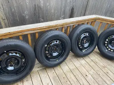 Selling a set of 4 Continental ProContact TX 225/65R17 102H M+S all-season tires mounted on original...