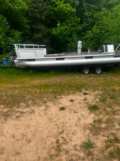 Pontoon boat needs repair or rebuild to suit does not have engine would probably make a better float...