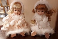 2 BISQUE COLLECTOR DOLLS WITH WIND-UP MUSIC BOX AND ORNAMOTION