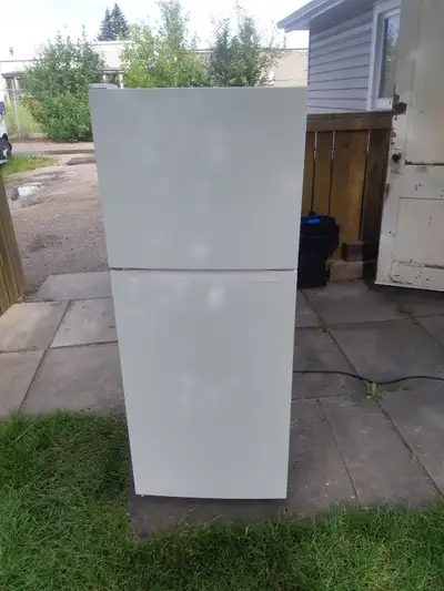 Apartment size fridge Frost Free approximately 4 years old