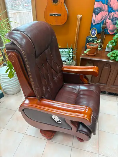 Gorgeous executive pure leather and solid wood reclining desk chair. Bought for my wife who did not...