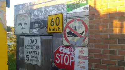 LOTS OF SIGNS AND OTHER MAN CAVE DECOR( tractor grills etc) also have antique vending machine, 7ft t...