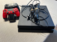 PlayStation 4 w/2 wireless controllers, charger & games