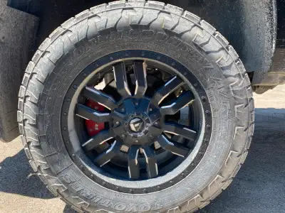 Approximately 30 to 40% tread, Life left on the tires Size is 295, 65R20