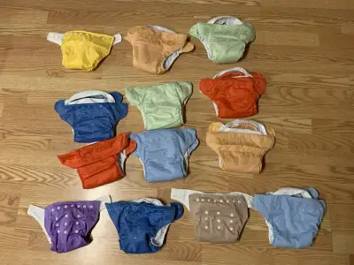 13 Bum Genius & Baby City Reusable Cloth Diapers $125 all, View more