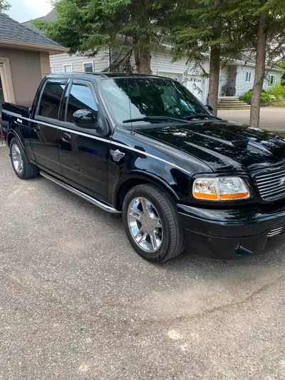Factory super. Charged V8 used as a toy not winter driven. A very clean truck cold AC leather four b...