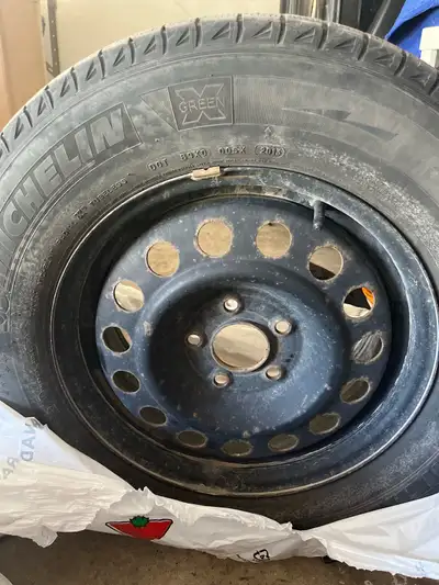 Winter tires and rims 215, 70 r16 Winter tires and well used one more winter 50$ for tires and rims...