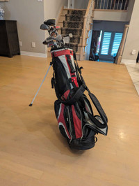 Assorted golf clubs and golf bag