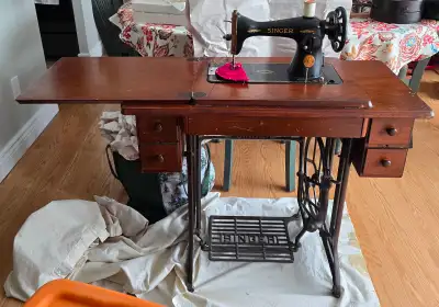 Sewing machine with accessories and manual.