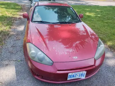 2007 Hyundai Tiburon Sun roof doesn't work and driver door doesn't lock. The clear coat is starting...