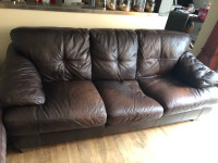 Two large leather sofas.   Dark brown.  Well loved.