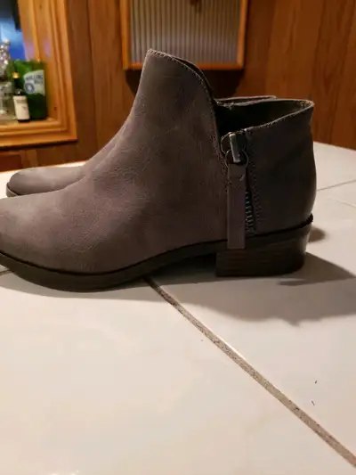 Fergalicious boots by Fergie. Brand new. Only worn inside to try them on. Too small. Size 6. Grey. P...