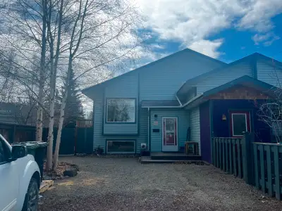 Takhini Duplex for sale, 3 bedroom, 2 bathroom. 1664 sq ft (832 sq ft/floor). Built in 1997, on a qu...