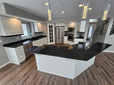 white kitchen with black granite countertops, View more