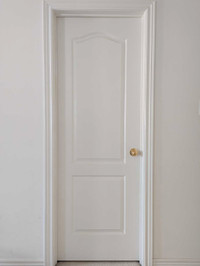 Two Panel 28" Arch-Top Hollow Core Textured Interior Doors.