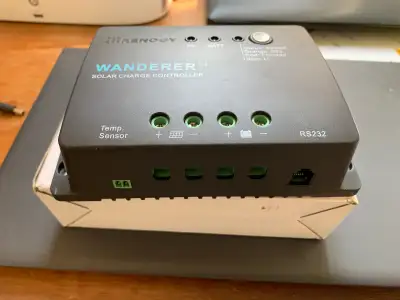 RENOGY 30 Amp. Charge controller for Solar Panel. Bought incorrect unit. Have sealed utility box as...