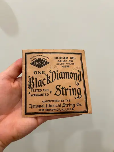 Cool antique guitar string in packaging
