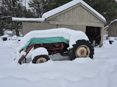 1964 B414 with 7 foot blower, loader ,7 foot plow , and tire chains. Ready for action. Tractor isnt...