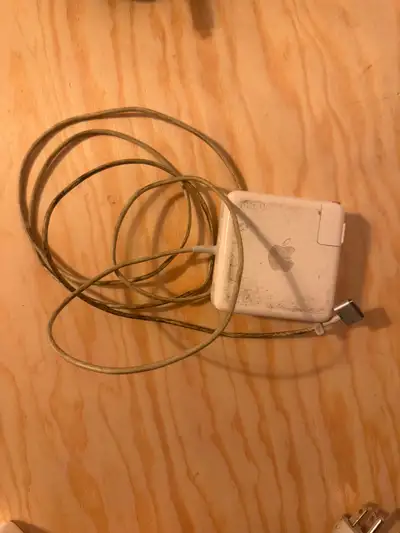 This is an Apple 85W MagSafe 2 Power Adapter. As you can see, it's a bit rough around the edges, sho...