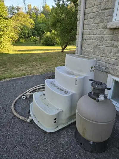 Swimming pool ladder, sand filter.