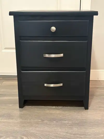 This charming refinished solid wood black nightstand is ready to add a touch of elegance to your bed...