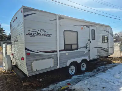 22-ft Jayco 2012 camper trailer. Features: > Walk around Queen bed. > Air conditioner > Couch which...