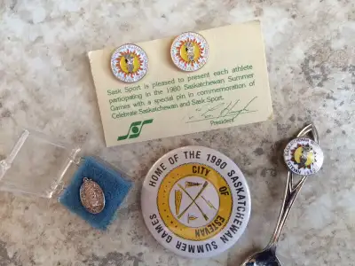 1980 Saskatchewan Summer Games Collectables; Estevan, Sask.; 2 pins with Lignite Louis logo; one spo...