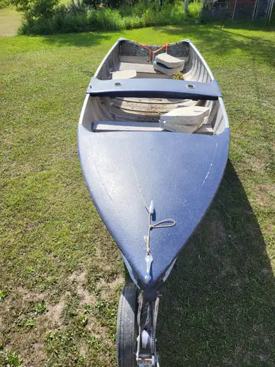 1960s Aluminum Princecraft boat with fiberglass bow and center console on trailer. No motor - I powe...