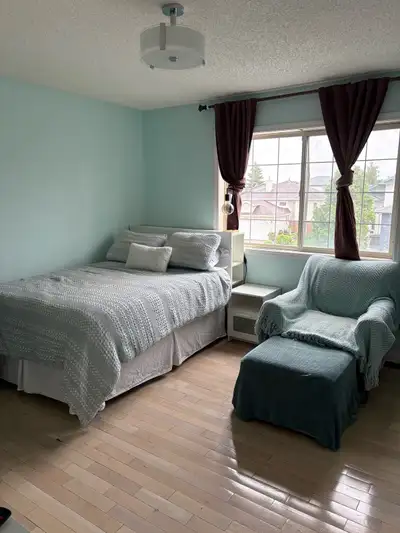 Extra large room in clean house in quiet north west neighborhood. Parking spot in driveway. All util...