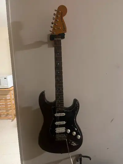 Squier Stratocaster brown guitar classic vibe 70’s. the only thing is that the input is broken but i...