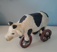 Vintage Cow on Wheels primitive style carved wood art figurine