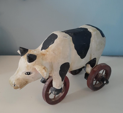 Vintage Cow on Wheels primitive style carved wood art figurine - I believe it has been hand painted...