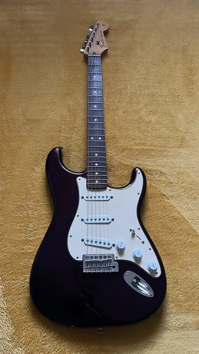 American body midnight wine, with a Mexican neck. Loaded pickguard with RioGrande Dirty Harry pickup...