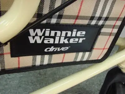 The Winnie Lite Supreme/Go-Lite Three Wheel Rollator by Drive Medical comes in an attractive tan fin...