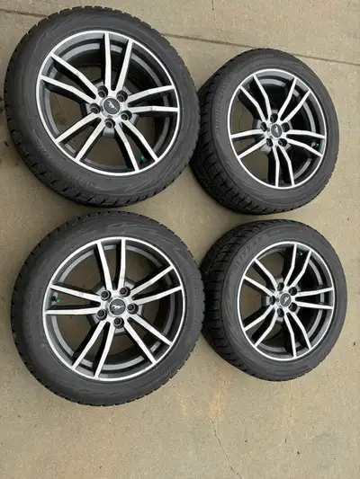 Bridgestone Blizzak snows (235/50-18) mounted on wheels from a 2015 Mustang GT. Tires have about 2/3...