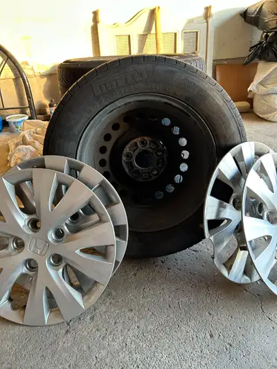 I am selling set of four all season tires with original rim and cover from Honda. It was use on Hond...