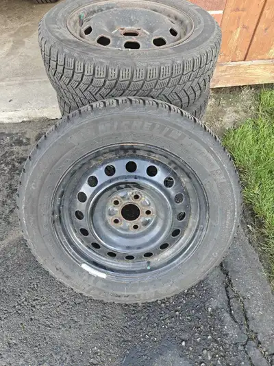 Michelin X-Ice tires with rims for sale. 185/65/R15. Only used 2 1/2 seasons. Purchased from Costco....