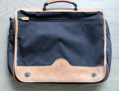 Great for laptop, iPad, books, or papers. Sturdy black nylon bag with leather trim. Carry with handl...