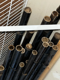 8 foot long dark brown bamboo poles 