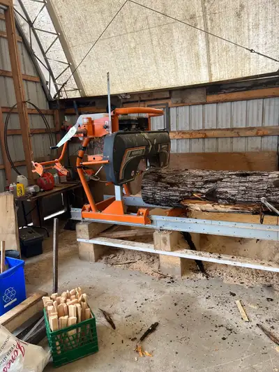 Norwood LM29 sawmill. Auto sharpener and tooth setter. Box of ten new blades. Used for only 154 hour...