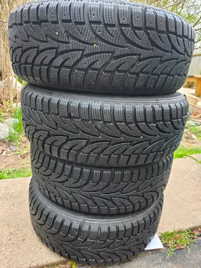 Set of winter tires on rims in excellent condition lots of tread remaining. Tread depth 12/32 Rims c...