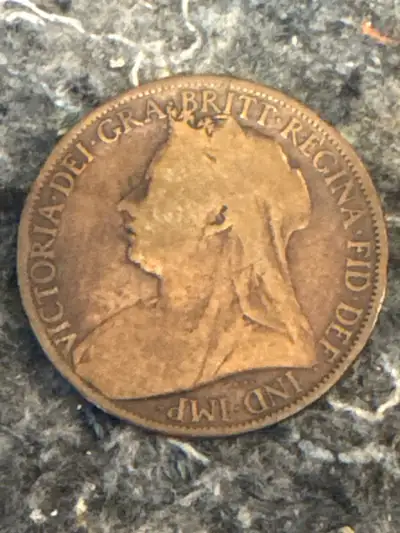 This is an 1899 Queen Victoria One Penny coin, a piece of history! Given its age, it shows signs of...