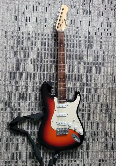 Perfectly working guitar, barely used. Good for beginners, only missing high E string. DOES NOT COME...