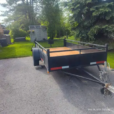 This is a 5x10 utility trailer featuring a newly stained floor, a 3,500 lb axle, and 15-inch tires,...